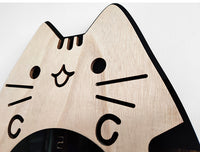 Designed for cat lovers and those who appreciate the silent beauty of functional art, this clock combines whimsical charm with practicality, creating a serene and playful atmosphere in any room.
