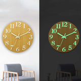 Minimalist wooden wall clock with luminous hands and hour markers, providing a soft glow and timeless elegance in low light.